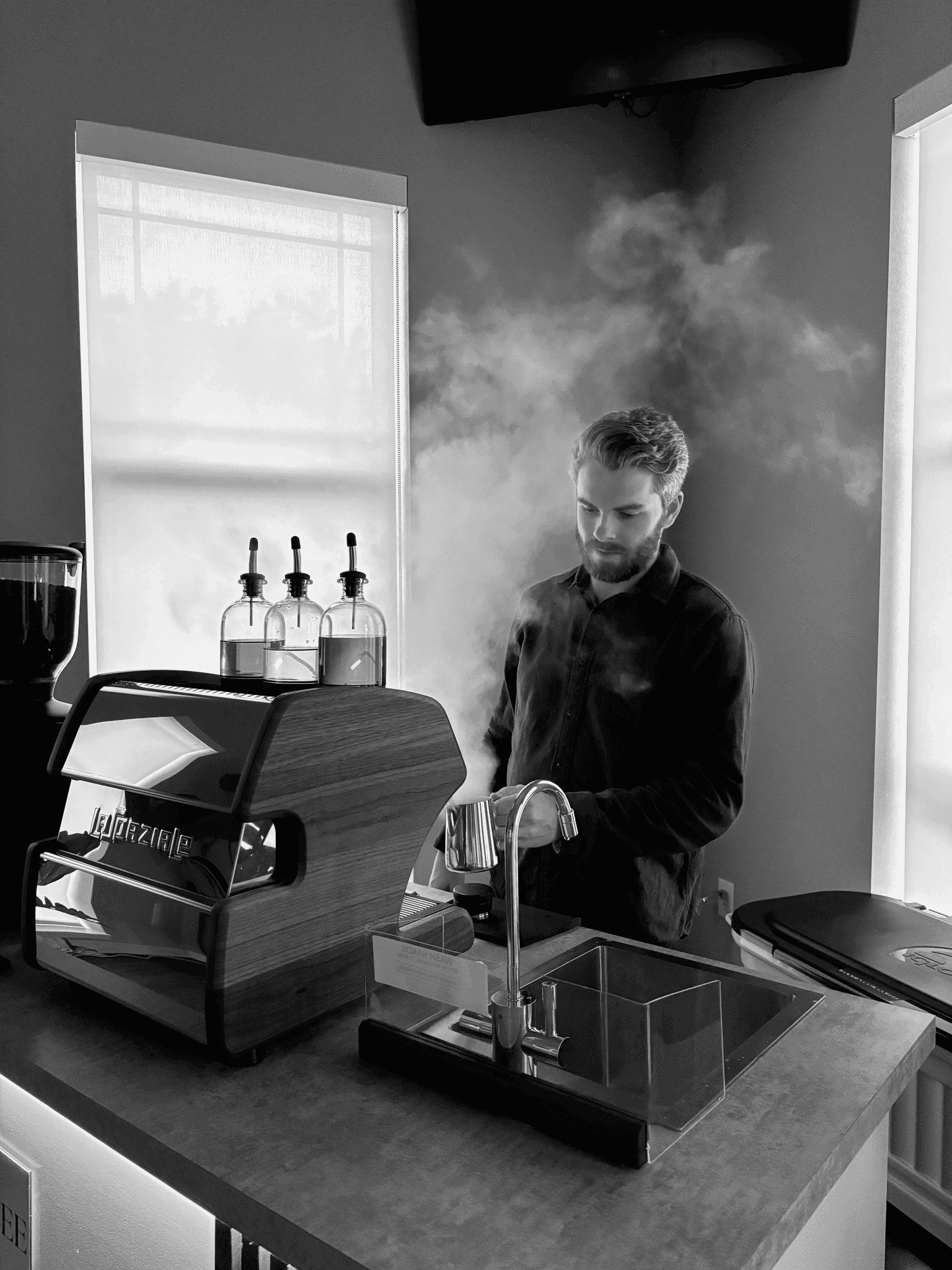 Barista steaming milk